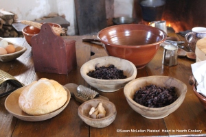 The table is set with the ingredients that will be needed to make the 1747 H. Glasse receipt (recipe) A Boiled Plumb-Pudding.