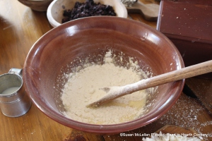 After the bread has been grated and flour weighed for the receipt (recipe) A Boiled Plumb Pudding stir the Flour and Bread  together and add by degrees.