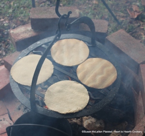 Peat fires provide a distinct aroma and tend to be smokier than wood fires that are easier to keep burning bright.  The receipt (recipe) for Oat Bannocks on the barred girdle consists of three ingredients: meal of oats, butter melted and salt.  The barred girdle is more challenging than baking the oat bannocks on a flat girdle but the pattern produced on the bannock is pleasing.