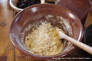 After the bread crumbs and flour have been stirred in the batter for the receipt (recipe) A Boiled Plumb-Pudding then the Suet.  The full receipt states take a Pound of Suet, cut in little Pieces, not too fine. 